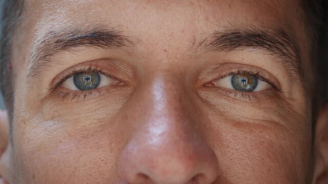 Male eyes in close up create feeling of trust reliability and authority. Calm direct gaze and natural facial detail communicate honesty leadership and credibility for business and professional concept