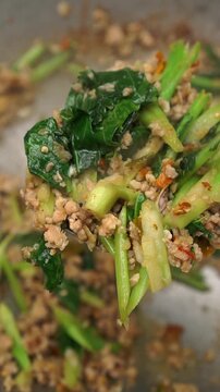 Pad Kana Kai Sab, Thai stir-fried Chinese broccoli with minced chicken.