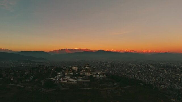 Aerial Buddhist Monastery Hill Kathmandu Himalayan Snowpeaks Wide Panorama Dusk , Gumba and Himalayan Range in Single Frame