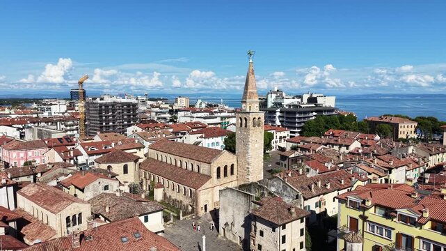 Grado, Italy with coastline, sea, and old town architecture during summer