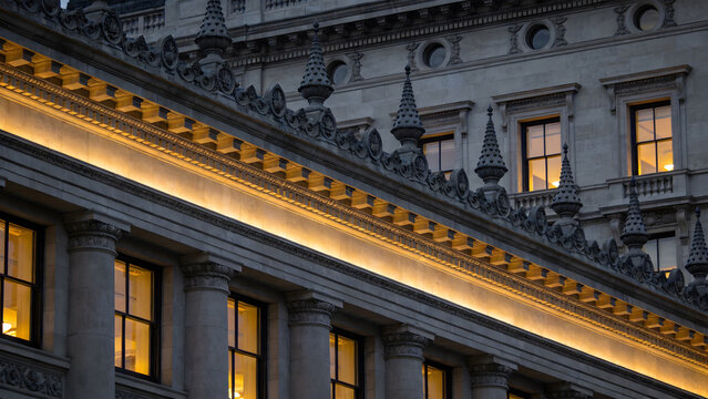 entablature. Classical architecture cornice featuring conical guttae details under soft window light. real-estate listings.