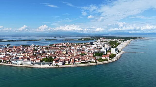 Grado, Italy with coastline, sea, and old town architecture during summer