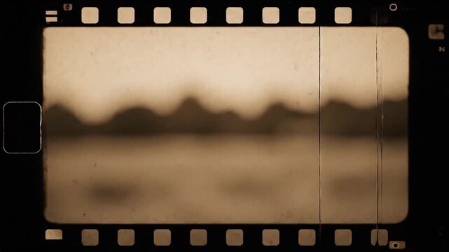 Sequential film strip frames capturing a blurred landscape during sunset creating a nostalgic cinematic effect