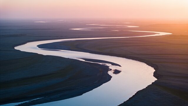 Snaking river channel reflecting sunlight, exposing sandbars and side channels on floodplain