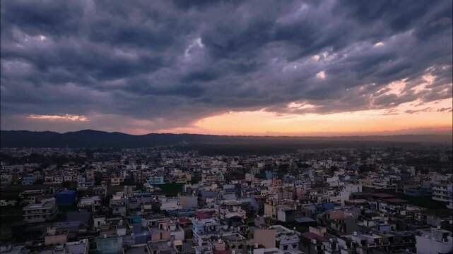 Cinematic hyperlapse of Monsoon Storm Clouds Over Dehradun City with Dramatic Sun Rays at Sunset, Uttarakhand, India