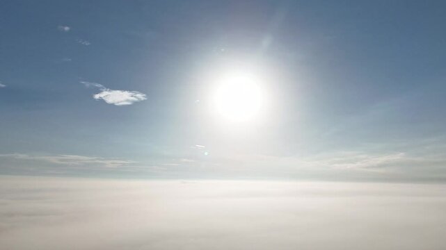 4K Hyperlapse Above Clouds With Sun and Blue Sky