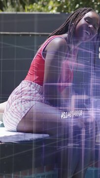 Vertical video: Woman relaxing, laughing poolside while camera zooming out, purple tech grid fading