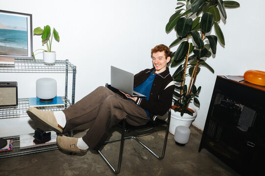 The remote work routine of a young man feels easy at home