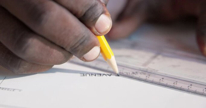 Man, drawing and hands of architect with blueprint in office for building, renovation or city planning. Sketch, civil engineering and contractor with stationery on construction design in workplace.