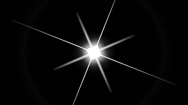 Bright white starburst lens flare on black background.