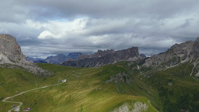 Majestic aerial view of Passo Giau mountain pass with the stunning Ra Gusela and Nuvolau peaks, a famous landmark in the Italian Dolomites