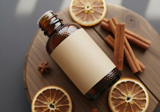 Amber Glass Bottle Mockup with Cinnamon and Dried Orange Slices
