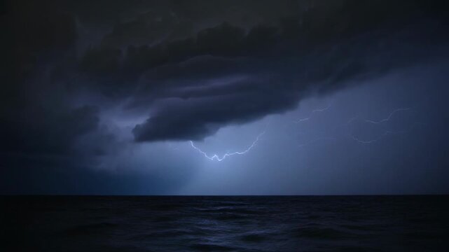 First bright flash starting from charged core, shelf cloud firing lightning over ocean at night