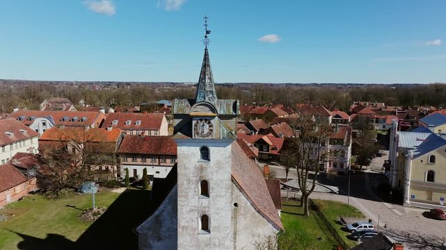 Aerial View of Holy Trinity Church Clock Tower and Old Town Kuldiga Latvia