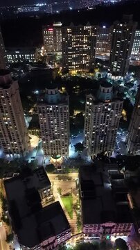 Vertical Aerial Night View of Mumbai Skyline and Illuminated Cityscape