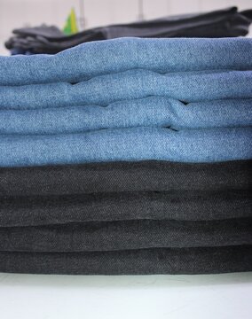 Folded Blue and Black Denim Jeans Stack