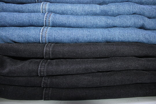 Folded Blue and Black Denim Jeans Stack