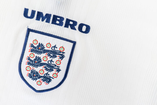 Bradford, UK June 24 2026 - Close-up of England's national football team 'Three Lions' crest on a white retro replica UMBRO Euro 1996 home team shirt.