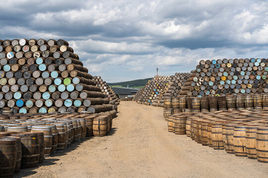 Stacked whisky barrels at Cooperage in Craigellachie, Moray, Scotland where new barrels are made for spirits