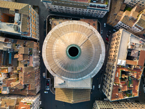 Aerial view of the Pantheon dome surrounded by historic urban buildings and narrow streets in Rome, Lazio, Italy.