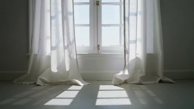 Billowing white sheer curtains swaying in soft breeze through paned window at home, casting grid