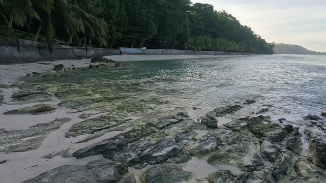 Rocky Coastline of Kalapathar Beach with Turquoise Waves in Havelock Island, Andaman