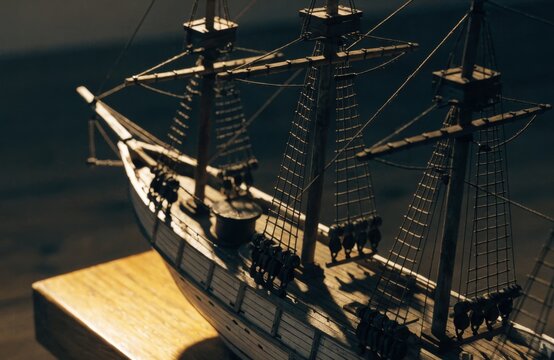 Detailed miniature galleon model with intricate rigging and wooden deck