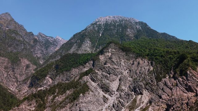 Friulian Dolomites under a bright summer sky. Beautiful high altitude alps mountain terrain, Italy.