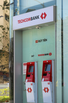 NHA TRANG, VIETNAM - JANUARY 26, 2026: A vertical view of the Techcombank corporate sign letters displayed above two automated teller machines (ATM).