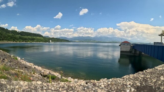 Scenic view of the liptovska mara reservoir with the tatra mountains in the background