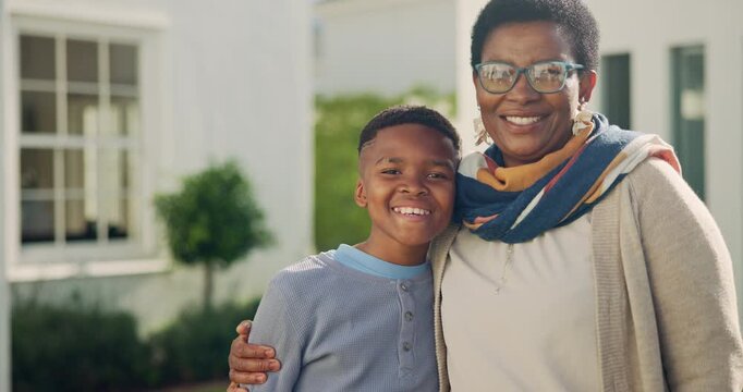 Face, grandma and child in front yard with new home, property investment and hug for real estate. Black people, senior woman and embrace with boy, grandparent house and family outdoor for relocation.