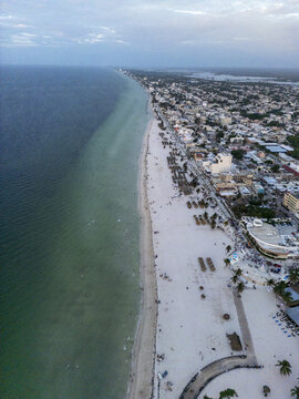 Aerial view of Playa Puerto Progreso with white sand, turquoise water, and coastal buildings in Progreso, Yucatan, Mexico.