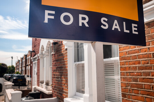 LONDON - for sale sign outside terraced house