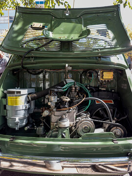 TAVERNES BLANQUES, SPAIN - JUNE 14, 2026.Well maintained retro engine bay of green SEAT E at classic car show under bright sunlight on a warm day