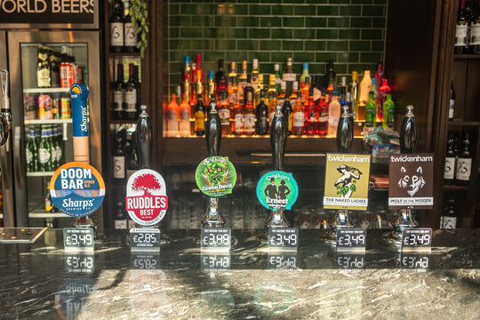 LONDON - Walham Green Real Ales &ndash; Selection of craft and real ale beer taps at the Walham Green Wetherspoons bar.