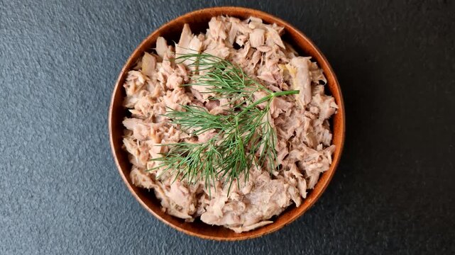Fish, canned tuna chunks in brine for sandwiches and salads. Canned tuna as a food background for your design