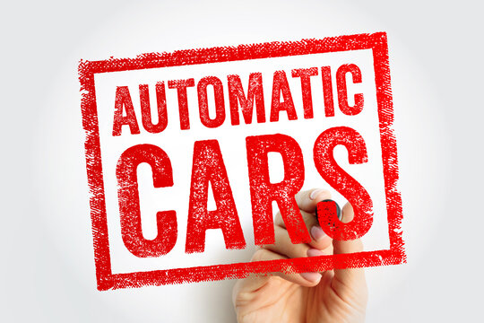 AUTOMATIC CARS text in a rubber stamp style box being drawn by a hand with a marker. This concept represents transmission technology and modern vehicle features on a clean light background