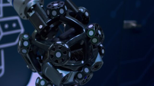 Close-up of an automated laser arm manipulator during quality control. Advanced industrial metrology and 3D measuring.