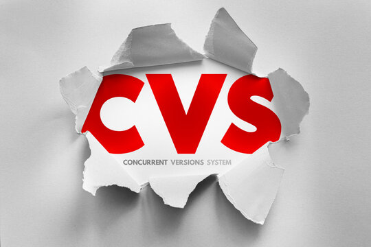 CVS Concurrent Versions System text revealed through torn paper representing version control, source management, collaboration, code history, software development workflow, repository tracking