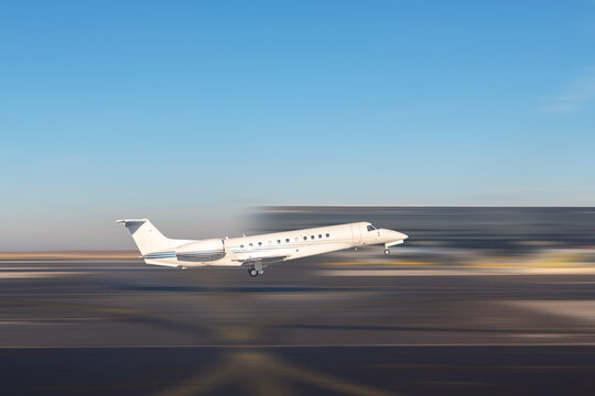 Mid size modern vip private jet departure and take-off on airport runway. Pilot asking air traffic control officer for take-off clearance. Luxury small corporate charter business aircraft trip