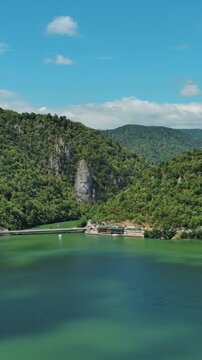 Aerial view of stone carved statue portrait of ancient dacian king Decebal. Sculpture near Danube River, Romania. Vertical video 4k