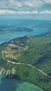 Aerial view on the Danube river and mountains in Djerdap National Park, Serbia Romania border. Vertical video 4k