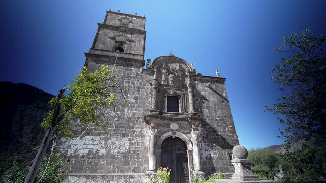 Explore the historic San Javier Mission church in Baja California surrounded by mountains and desert landscapes near Loreto