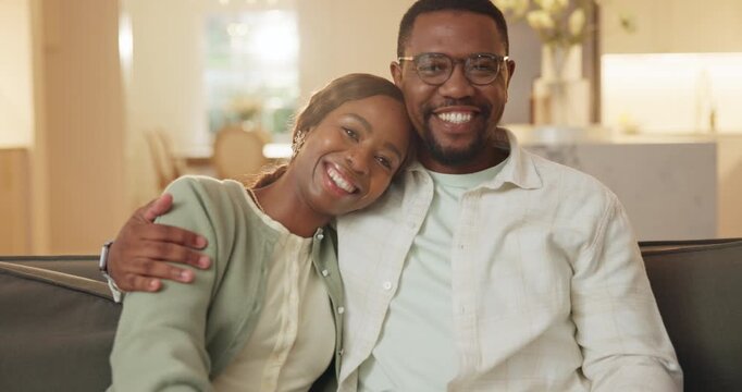 Happy couple, face and hug on sofa, home and bonding with partner on break, commitment or connection. Black people, portrait and smile with spouse on couch, support and embrace with love in house