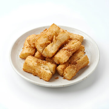 Golden fried pastries on a white plate.
