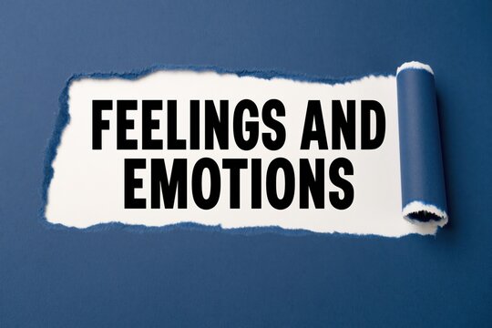 Feelings and emotions words written on white paper under blue rip