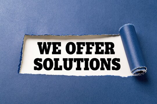 We offer solutions phrase written on white paper under torn dark blue background
