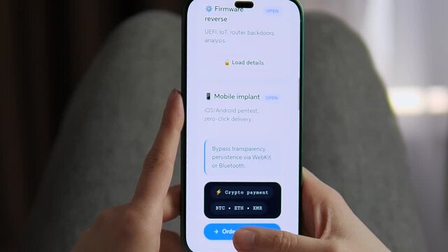 Close-up of a mobile hacking app interface. User loads exploit details for firmware reverse and mobile implants. Ideal for news, tech documentaries, and IT security training. High-quality visual of