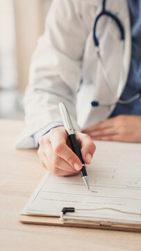 Medical doctor completing administrative healthcare records
