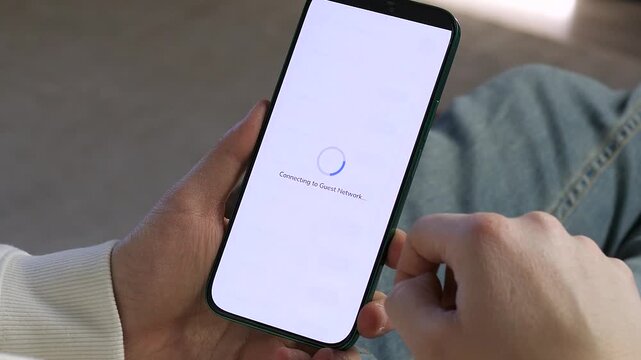 Close-up of a person successfully connecting their phone to public WiFi. Features a clean, modern interface with network status alerts. Ideal for showcasing digital connectivity, internet access, and